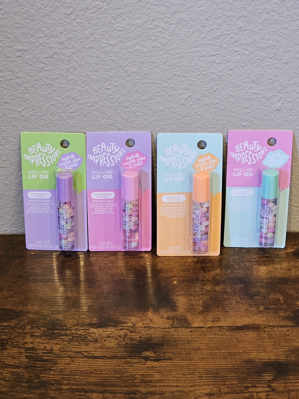 NWT Beauty Impressions Roll-On Lip Oil Bundle (Assorted Pastel Caps)